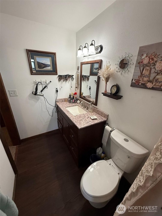 416 Cedar St S, Omak, WA 98841 - bathroom featuring vanity and wood finished floors