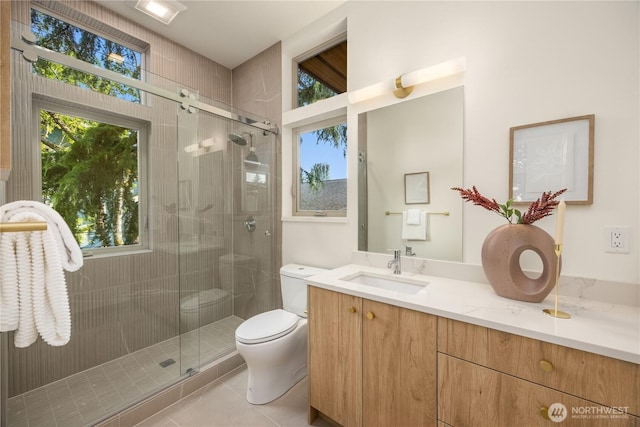 4615 2nd Ave NE, Seattle, WA 98105 - full bath with vanity, tile patterned flooring, and a stall shower