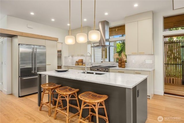 4615 2nd Ave NE, Seattle, WA 98105 - kitchen featuring stainless steel built in refrigerator, island exhaust hood, light wood-style flooring, backsplash, and recessed lighting
