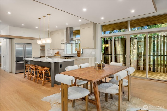 4615 2nd Ave NE, Seattle, WA 98105 - dining area with light wood-style floors, plenty of natural light, and recessed lighting
