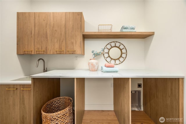 4615 2nd Ave NE, Seattle, WA 98105 - laundry area featuring hookup for an electric dryer, cabinet space, and light wood finished floors