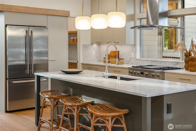 4615 2nd Ave NE, Seattle, WA 98105 - kitchen with stainless steel built in fridge, island exhaust hood, modern cabinets, a breakfast bar area, and hanging light fixtures