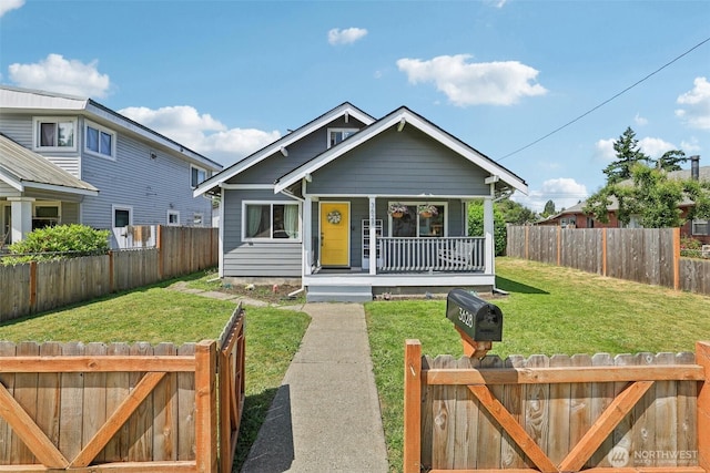 3628 S Sheridan Ave, Tacoma, WA 98418 - bungalow-style house with covered porch and a fenced backyard
