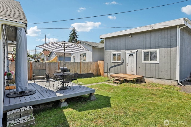 3628 S Sheridan Ave, Tacoma, WA 98418 - fenced backyard with a wooden deck and outdoor dining space