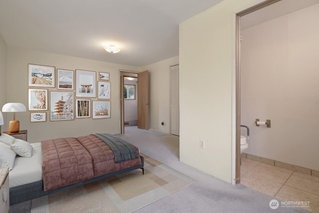 8718 Dresden Ln SW, Lakewood, WA 98498 - tiled bedroom with ensuite bathroom and carpet flooring