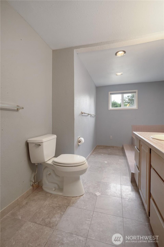 8718 Dresden Ln SW, Lakewood, WA 98498 - bathroom with vanity and a textured ceiling