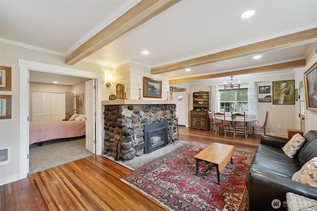 8038 S Ainsworth Ave, Tacoma, WA 98408 - living room with wood finished floors, ornamental molding, beamed ceiling, a chandelier, and recessed lighting