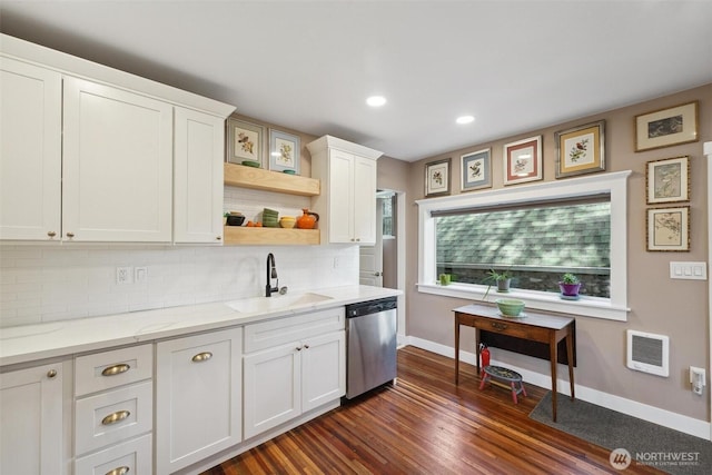 8038 S Ainsworth Ave, Tacoma, WA 98408 - kitchen with stainless steel dishwasher, dark wood-type flooring, tasteful backsplash, white cabinets, and heating unit