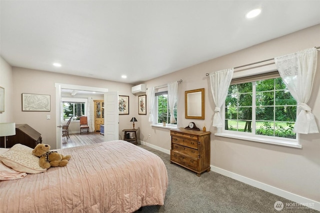 8038 S Ainsworth Ave, Tacoma, WA 98408 - carpeted bedroom featuring a wall mounted AC, multiple windows, and recessed lighting