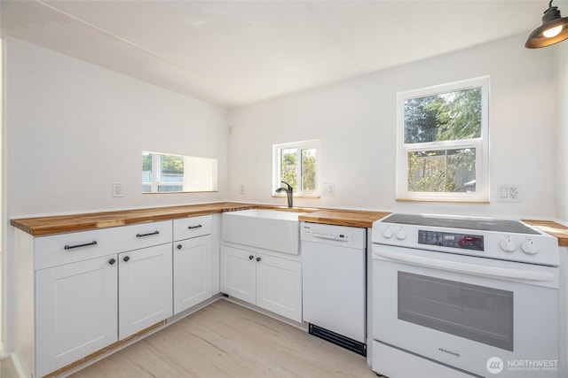 2500 Samish Way Unit 44, Bellingham, WA 98229 - kitchen with white appliances, butcher block counters, white cabinetry, and light wood finished floors