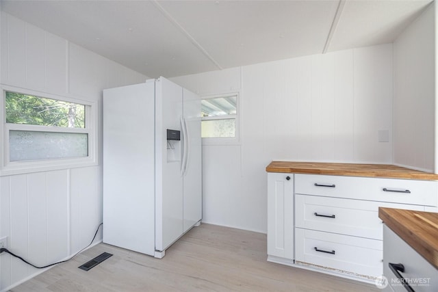 2500 Samish Way Unit 44, Bellingham, WA 98229 - kitchen featuring wood counters, white fridge with ice dispenser, white cabinets, and light wood-style floors