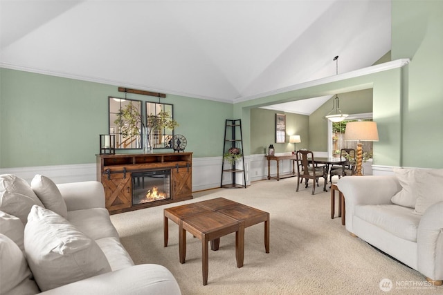 14809 283rd Pl NE, Duvall, WA 98019 - carpeted living area with lofted ceiling, a wainscoted wall, a glass covered fireplace, and ornamental molding