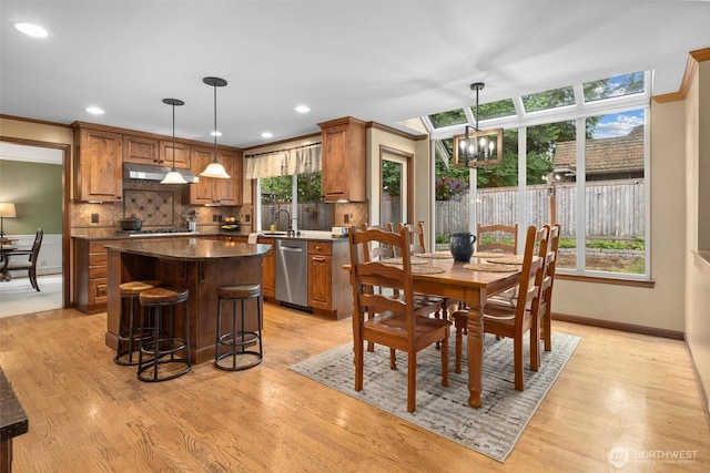 14809 283rd Pl NE, Duvall, WA 98019 - dining space featuring a chandelier, light wood-style floors, recessed lighting, and crown molding