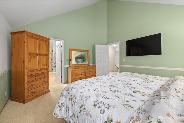 14809 283rd Pl NE, Duvall, WA 98019 - bedroom with light carpet, high vaulted ceiling, and connected bathroom