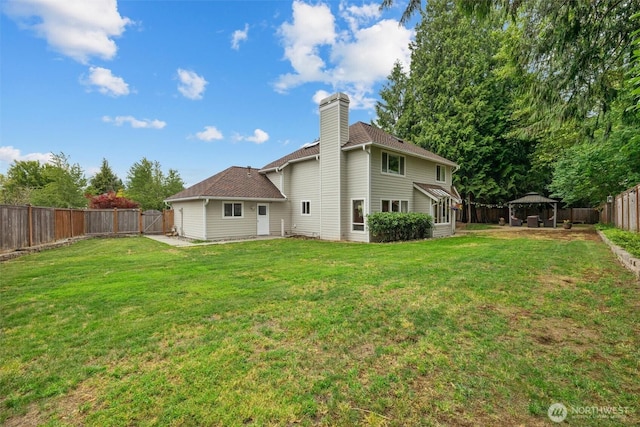 14809 283rd Pl NE, Duvall, WA 98019 - back of property with a gazebo, a fenced backyard, and a chimney