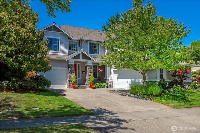 6703 Marshall Ave SE, Auburn, WA 98092 - craftsman-style house with driveway, stone siding, a front yard, and an attached garage