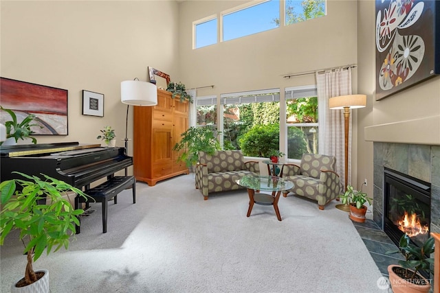 6703 Marshall Ave SE, Auburn, WA 98092 - living area with a fireplace, a high ceiling, and carpet floors