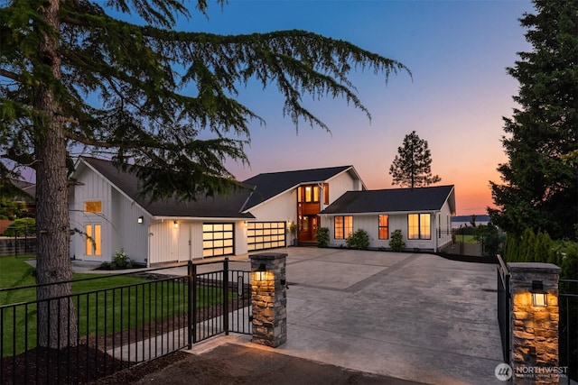 18505 Normandy Ter SW, Normandy Park, WA 98166 - modern farmhouse with driveway, an attached garage, a fenced front yard, and a gate