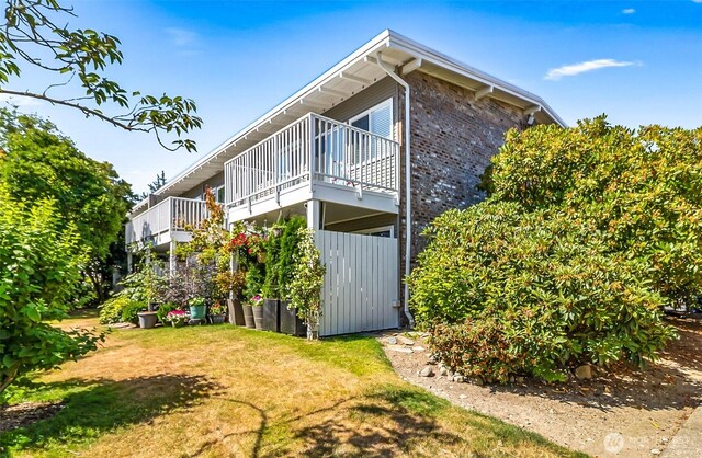 5720 122nd Ave SE Unit 179, Bellevue, WA 98006 - back of property featuring brick siding and a balcony
