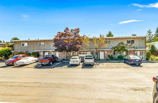 5720 122nd Ave SE Unit 179, Bellevue, WA 98006 - view of property with uncovered parking