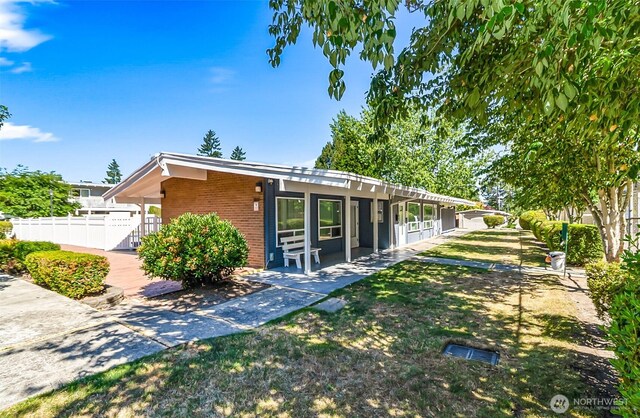5720 122nd Ave SE Unit 179, Bellevue, WA 98006 - back of house with brick siding and a patio area