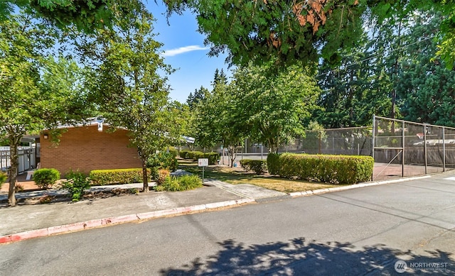5720 122nd Ave SE Unit 179, Bellevue, WA 98006 - view of property hidden behind natural elements with brick siding