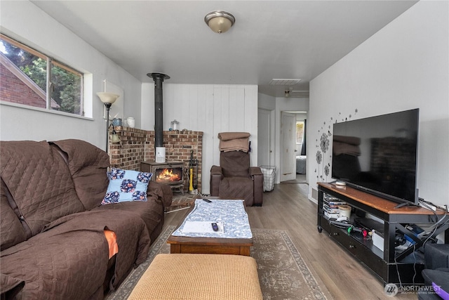 5221 S I St, Tacoma, WA 98408 - living room with wood finished floors and a wood stove