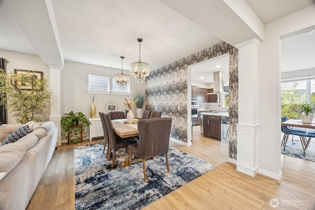 18437 111th Ave E, Puyallup, WA 98374 - dining space with a chandelier and light wood-style floors