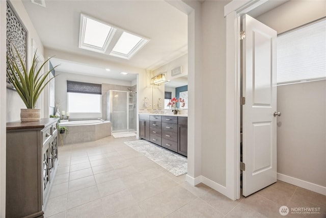 18437 111th Ave E, Puyallup, WA 98374 - full bathroom with vanity, tile patterned flooring, a shower stall, and a garden tub