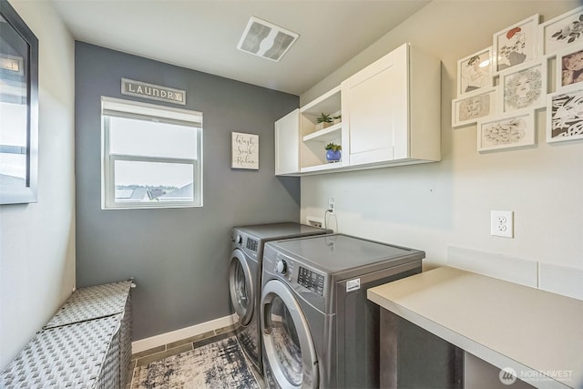 18437 111th Ave E, Puyallup, WA 98374 - washroom with cabinet space and washing machine and clothes dryer