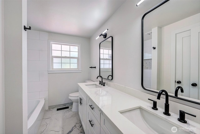 19807 80th Pl W, Edmonds, WA 98026 - bathroom with marble look tiles, double vanity, and  shower combination