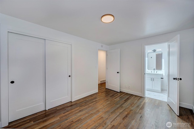19807 80th Pl W, Edmonds, WA 98026 - unfurnished bedroom featuring wood finished floors, a closet, and ensuite bath