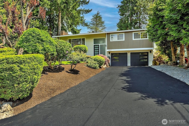 19807 80th Pl W, Edmonds, WA 98026 - bi-level home featuring a garage and asphalt driveway