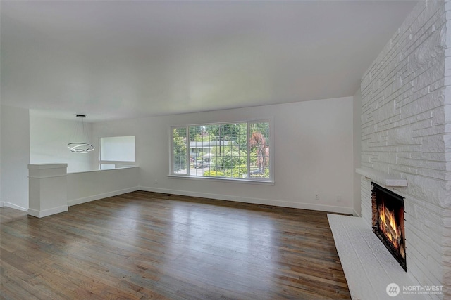 19807 80th Pl W, Edmonds, WA 98026 - unfurnished living room featuring a large fireplace and wood finished floors