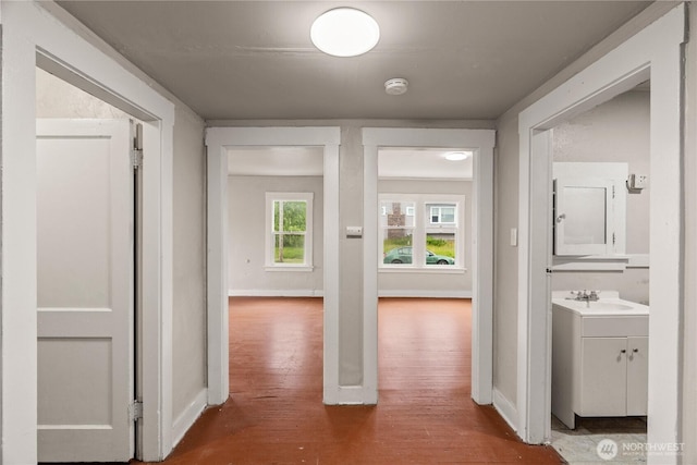 301 W 3rd St, Aberdeen, WA 98520 - corridor with wood finished floors and a sink