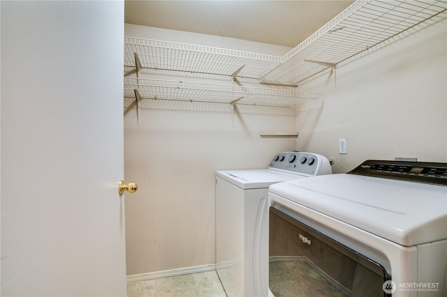3409 49th St NE, Tacoma, WA 98422 - washroom featuring washer and clothes dryer and baseboards