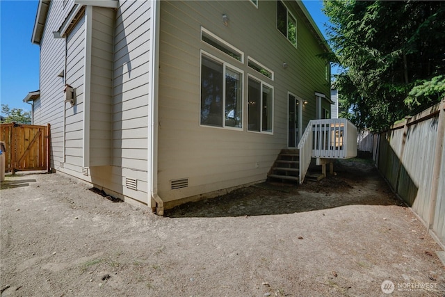 3409 49th St NE, Tacoma, WA 98422 - view of side of home featuring a wooden deck, a fenced backyard, and crawl space