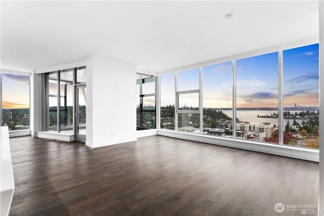 188 Bellevue Way NE Unit 1907, Bellevue, WA 98004 - unfurnished room featuring a wall of windows, a water view, and dark wood-style flooring
