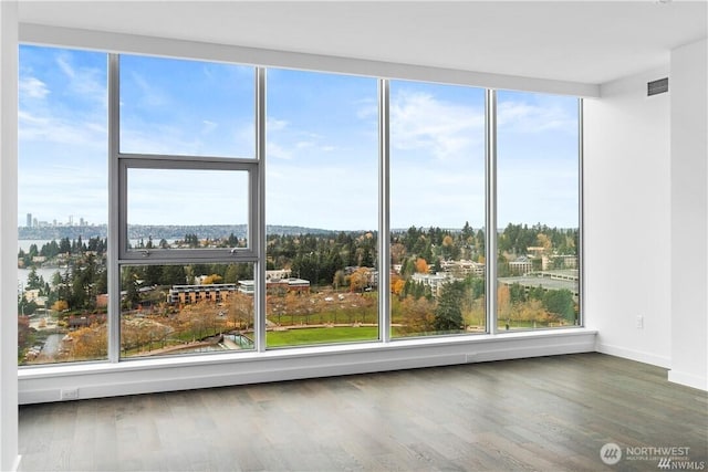 188 Bellevue Way NE Unit 1907, Bellevue, WA 98004 - unfurnished sunroom featuring healthy amount of natural light and a view of city