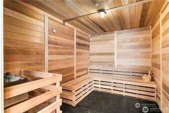 188 Bellevue Way NE Unit 1907, Bellevue, WA 98004 - relaxing sauna featuring wooden walls and wood ceiling