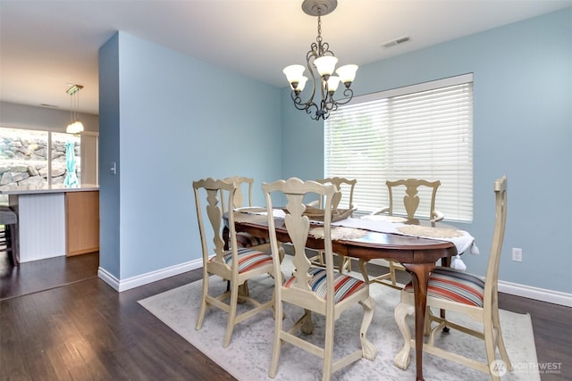1194 Swan Loop, Dupont, WA 98327 - dining room featuring dark wood-style flooring, healthy amount of natural light, and a chandelier