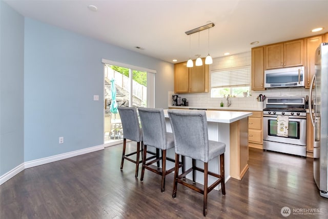 1194 Swan Loop, Dupont, WA 98327 - kitchen with appliances with stainless steel finishes, tasteful backsplash, light countertops, light brown cabinets, and recessed lighting