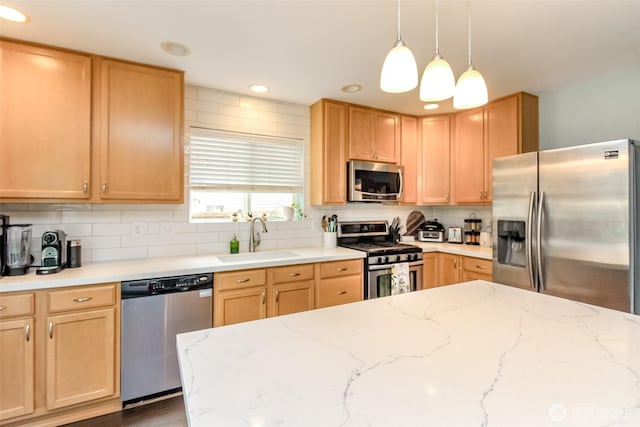 1194 Swan Loop, Dupont, WA 98327 - kitchen featuring appliances with stainless steel finishes, decorative backsplash, recessed lighting, light brown cabinets, and hanging light fixtures