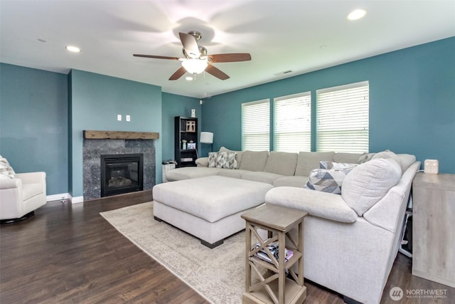 1194 Swan Loop, Dupont, WA 98327 - living area featuring ceiling fan, a glass covered fireplace, wood finished floors, and recessed lighting