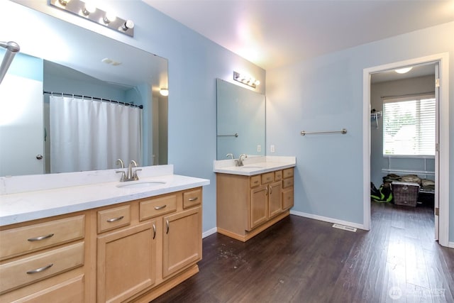 1194 Swan Loop, Dupont, WA 98327 - bathroom featuring wood finished floors and two vanities