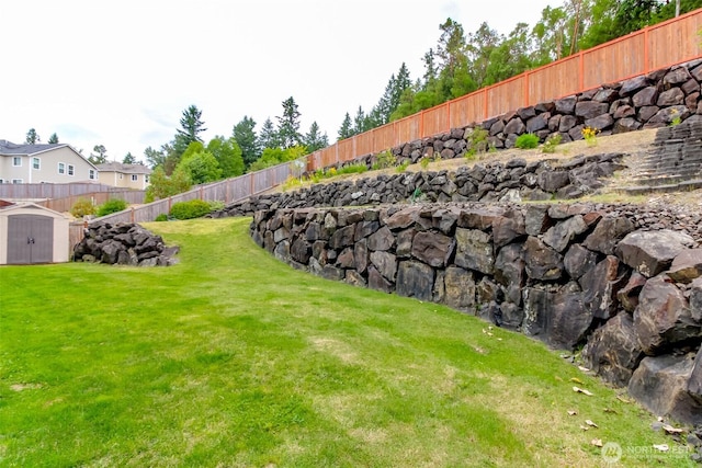 1194 Swan Loop, Dupont, WA 98327 - fenced backyard with a storage unit
