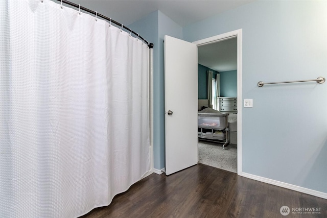 1194 Swan Loop, Dupont, WA 98327 - full bathroom with wood finished floors and curtained shower