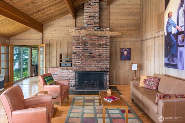 1585 Channel Rd, Lopez Island, WA 98261 - living room featuring wood walls, wood ceiling, wood finished floors, and a brick fireplace