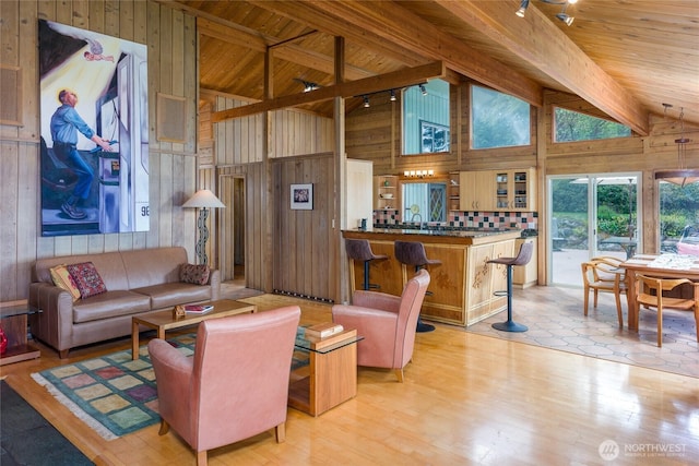 1585 Channel Rd, Lopez Island, WA 98261 - living area featuring wooden walls, a wood ceiling with exposed beams, high vaulted ceiling, and light wood-style floors