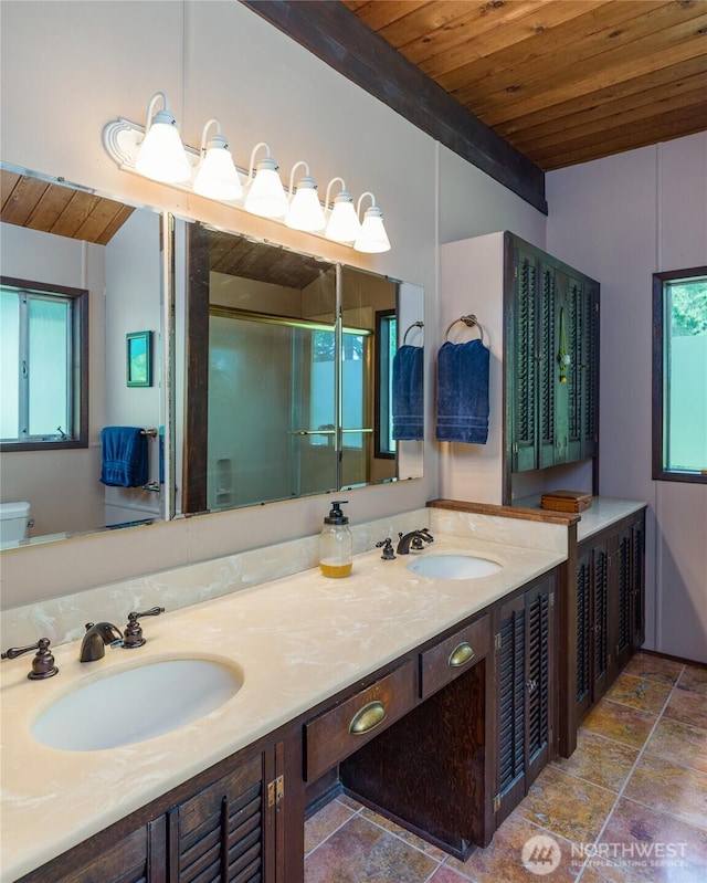 1585 Channel Rd, Lopez Island, WA 98261 - full bath featuring wooden ceiling, double vanity, stone finish flooring, a stall shower, and vaulted ceiling